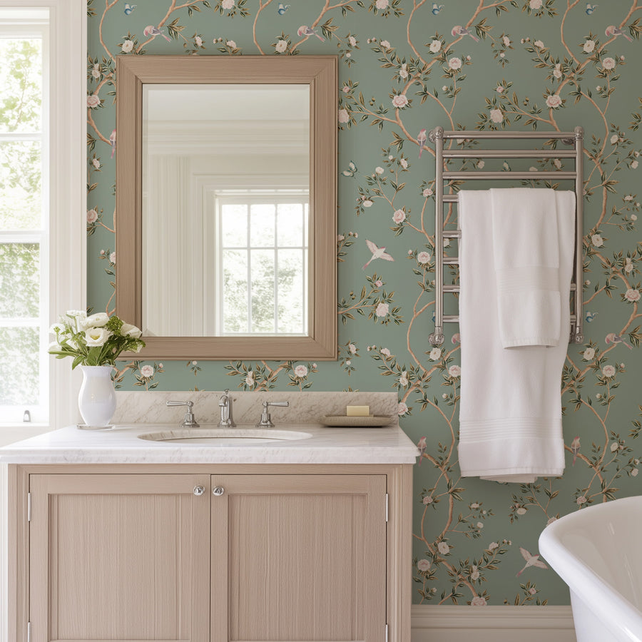 Bathroom with framed mirror sink and hanging towel featuring Light Green Chinoiserie Hemma Wallpaper Floral Garden Birds accent wall