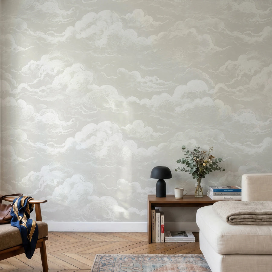 Light grey sky and clouds wall mural in a reading corner with a chair