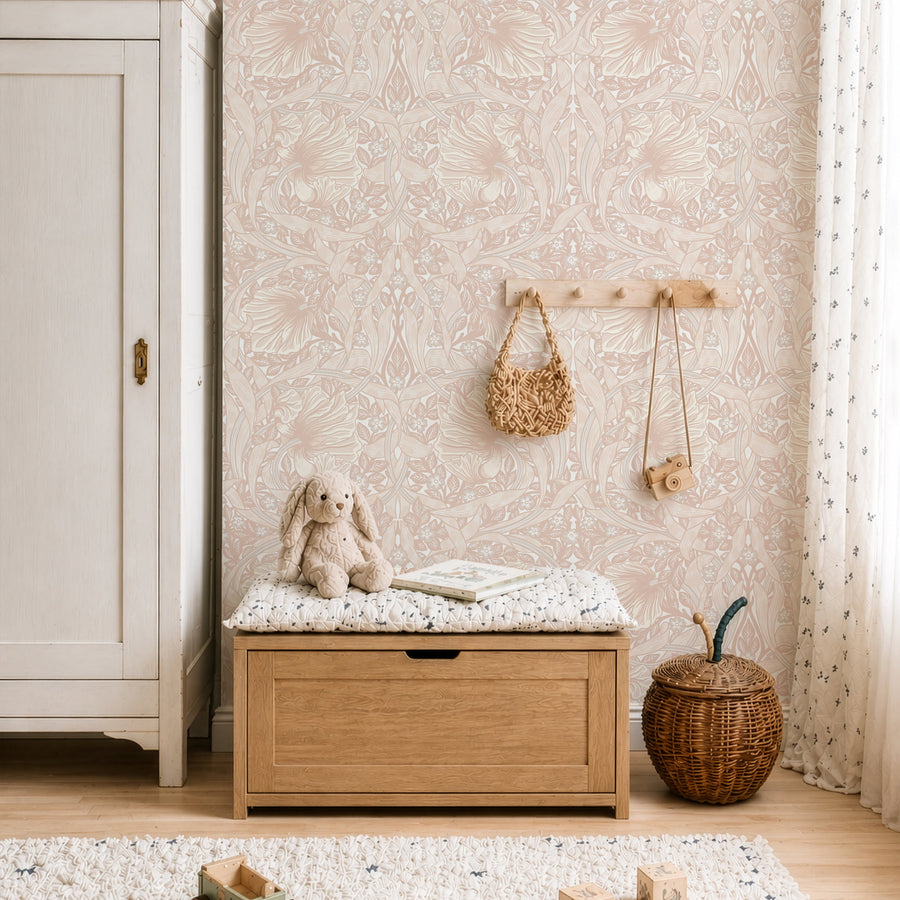 Light pink William Morris Pimpernel wallpaper in a nursery with crib and storage bench