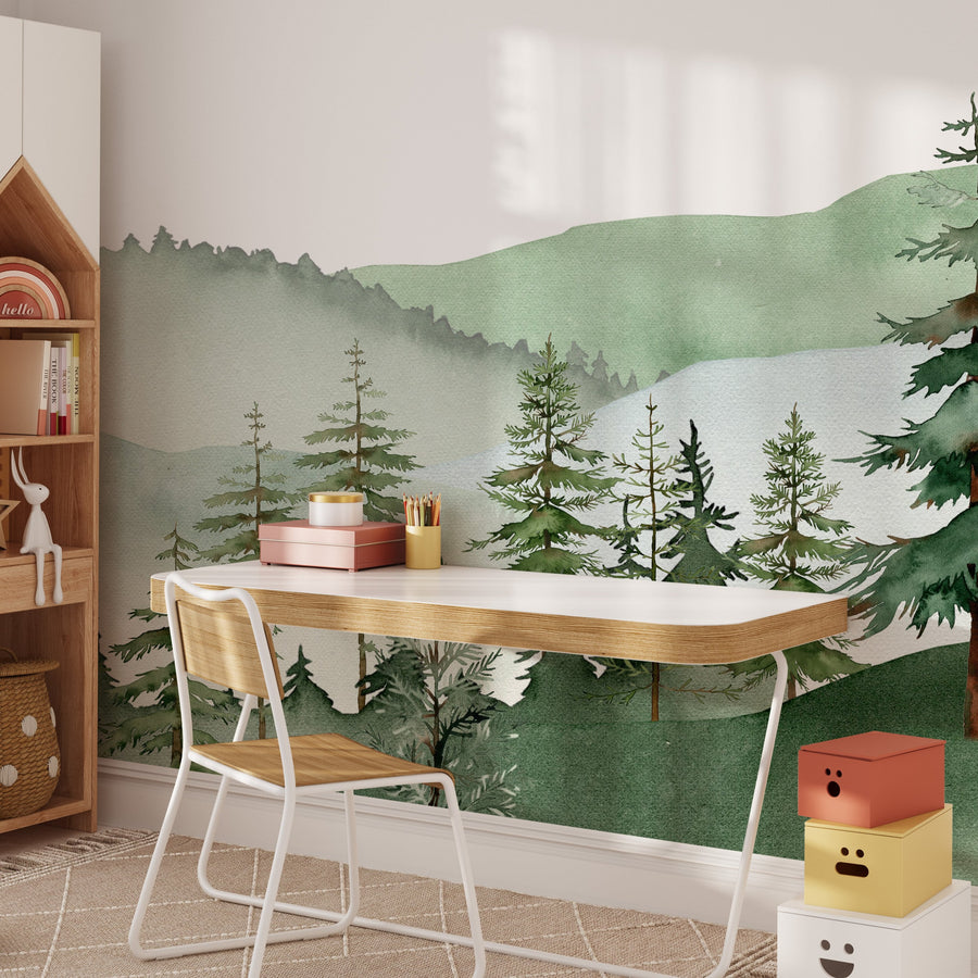 Full misty sage green mountain mural with layered watercolor hills, a row of pine trees and open pale sky