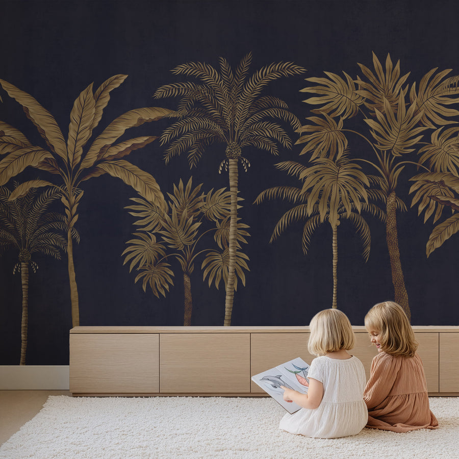 Navy and gold palm tree tropical wallpaper mural in a playroom with children reading
