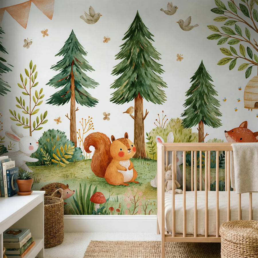 Pine tree and forest animals wall mural for kids by Uta Naumann behind a wooden crib with a squirrel, bunny and hedgehog