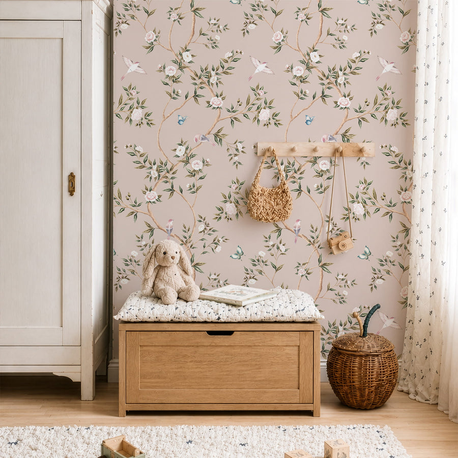 Nursery with wood storage bench wall hooks and stuffed bunny featuring Pink Chinoiserie Hemma Wallpaper Floral Garden Birds by Maja Pitschmann