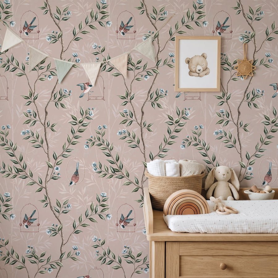 Nursery with wood dresser bunting flags teddy bear art and stuffed bunny featuring Pink Chinoiserie Pauline Wallpaper Birds Branches by Maja Pitschmann