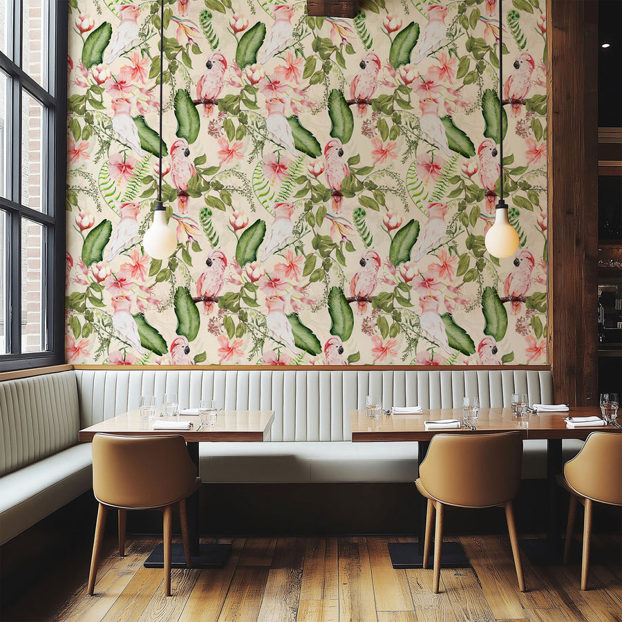 Pink cockatoo exotic tropical wallpaper in a restaurant with a green banquette