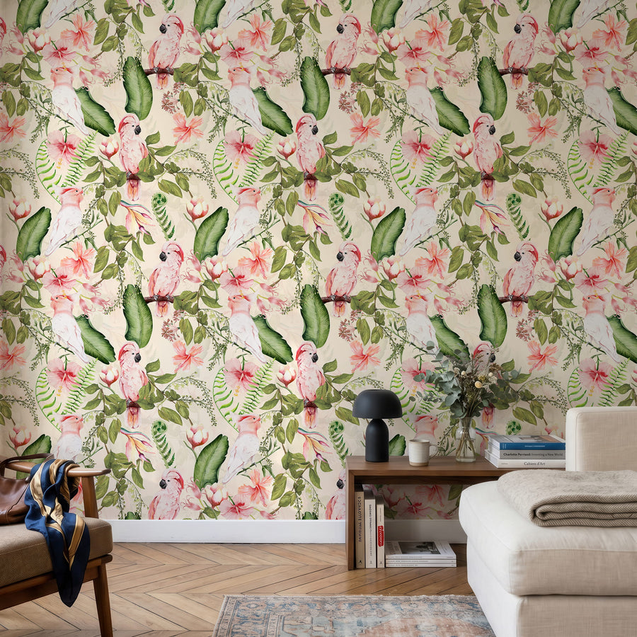 Pink cockatoo exotic tropical wallpaper in a sitting room behind a cream sofa