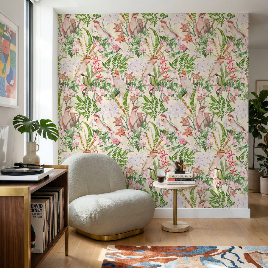 Pink parrots and green fern tropical wallpaper in a restaurant with a green banquette