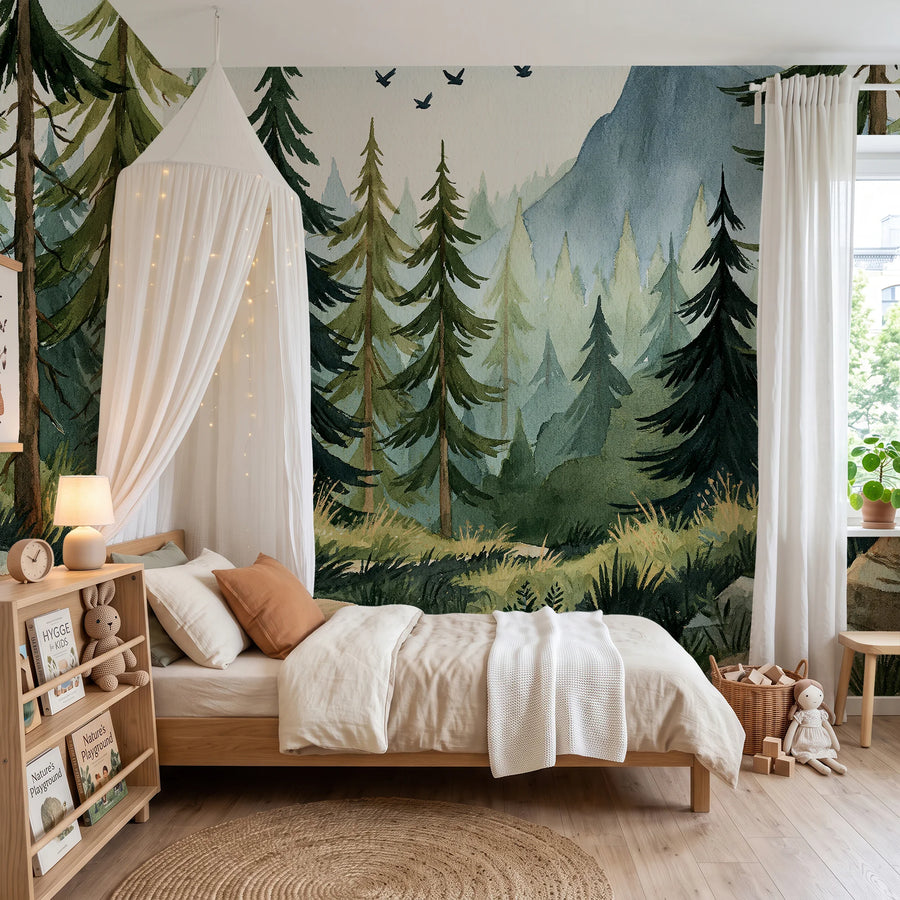 Mountain forest wall mural behind a canopy bed and bookshelf in a child's room