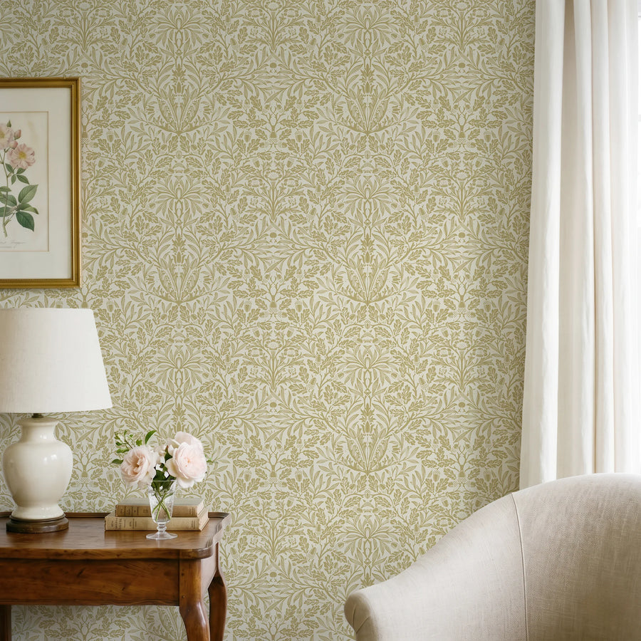 William Morris Acorn green wallpaper behind a console with a lamp