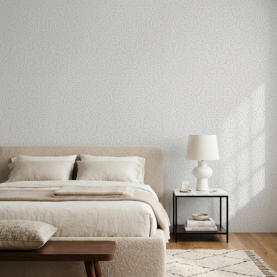 William Morris Acorn grey wallpaper in a bedroom with linen bedding