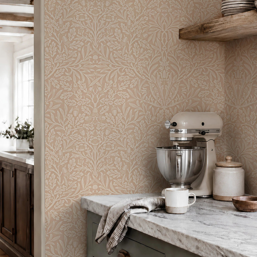 William Morris Acorn terracotta wallpaper in a kitchen with marble counter and wood shelves