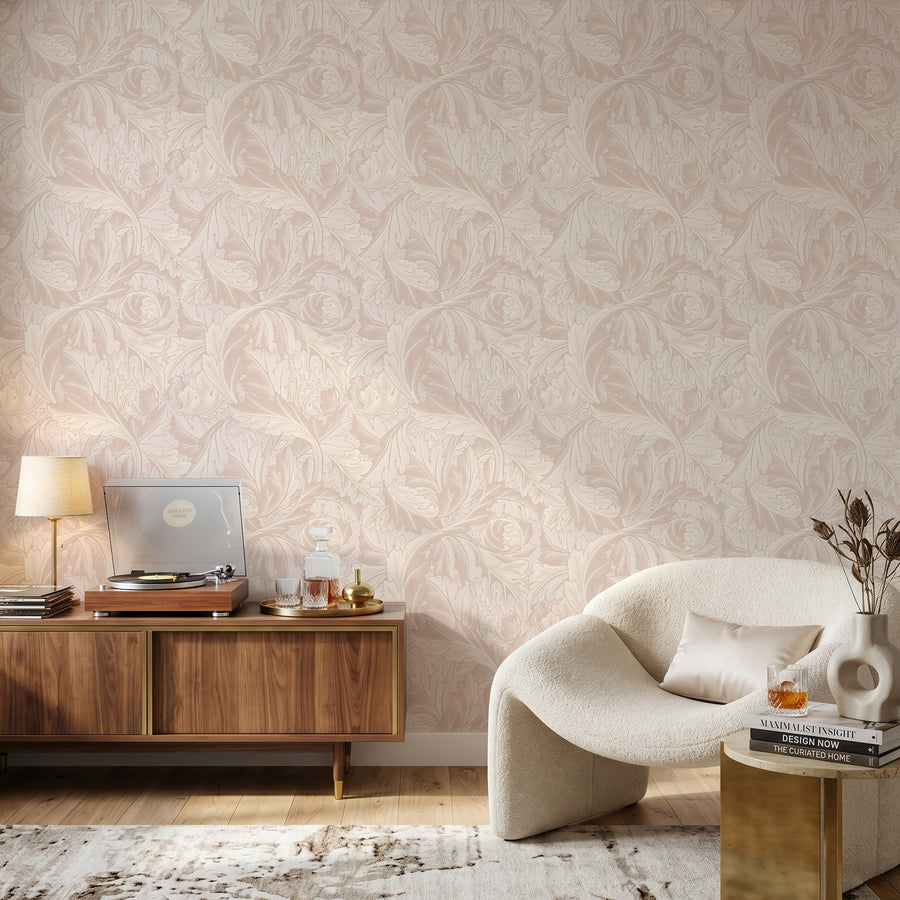 Blush pink Acanthus William Morris wallpaper in a sitting room with a boucle chair