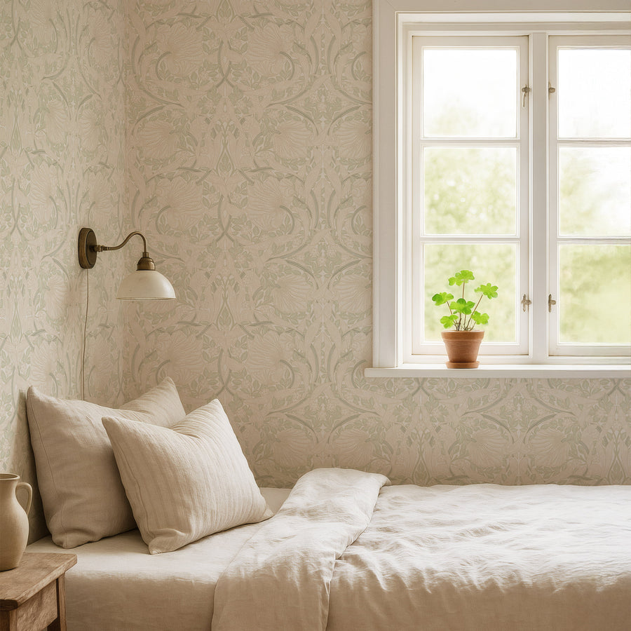 William Morris Pimpernel wallpaper in beige and sage green in a bedroom