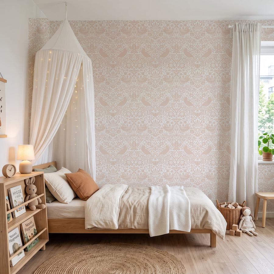 William Morris Strawberry Thief blush pink wallpaper in a nursery with a canopy bed