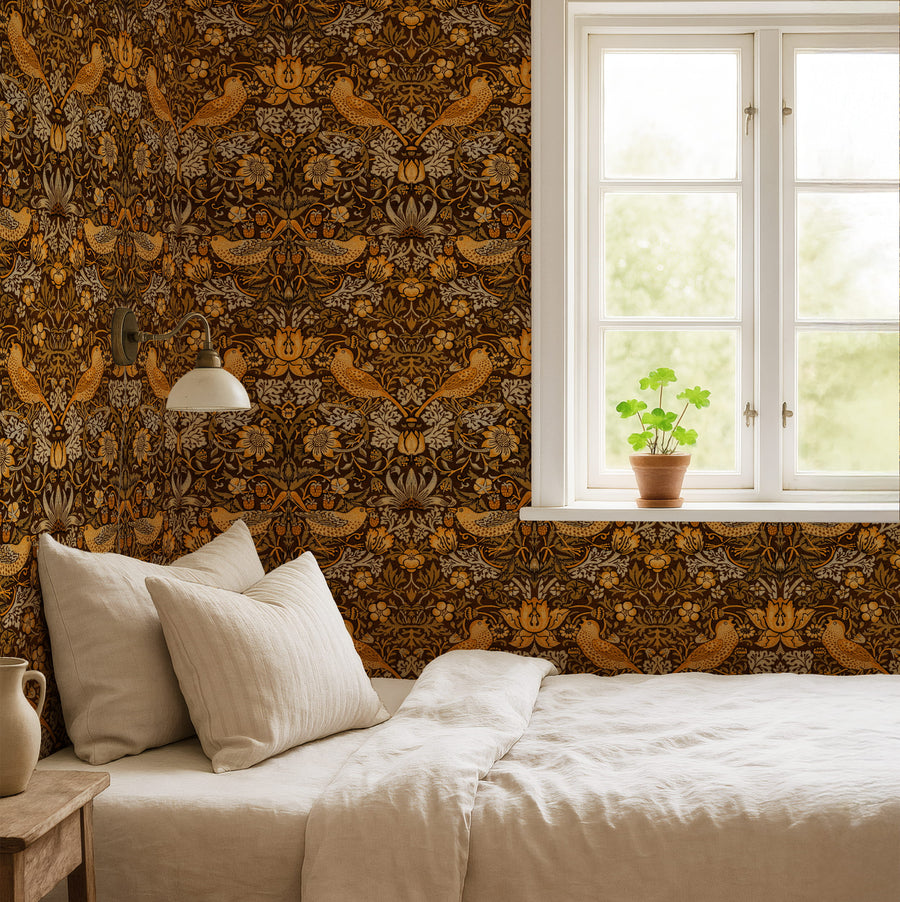 William Morris Strawberry Thief brown wallpaper in a bedroom with linen bedding