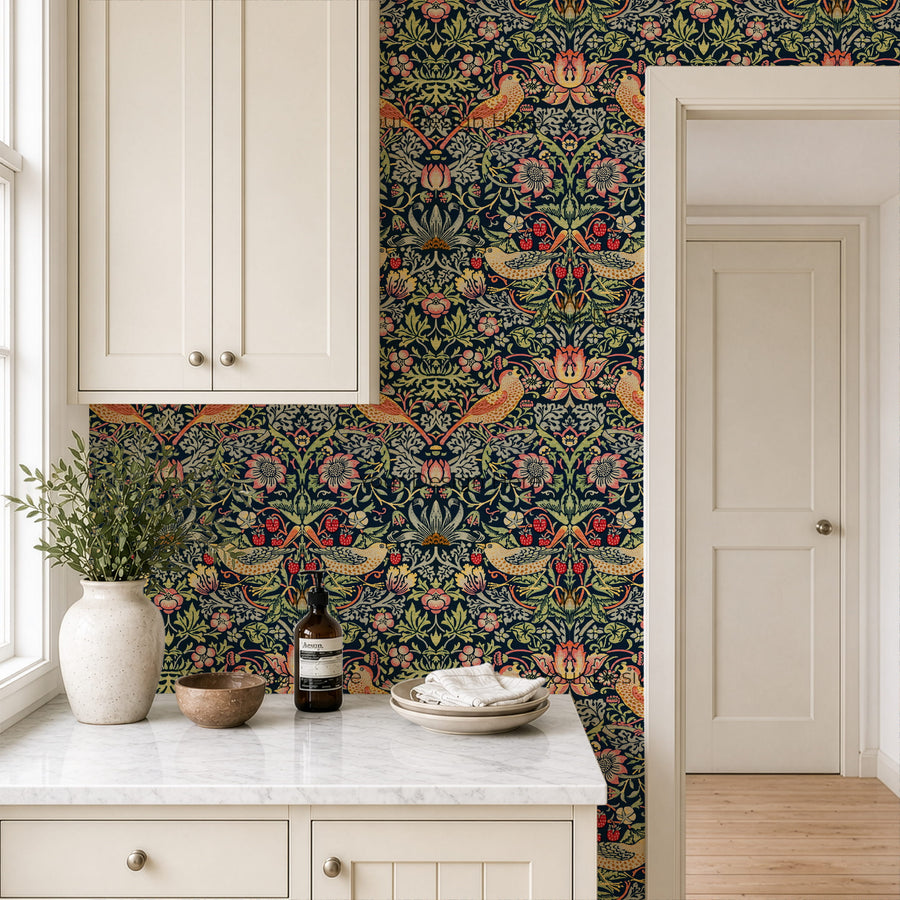 William Morris Strawberry Thief indigo wallpaper in a kitchen with white cabinets