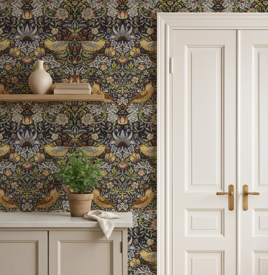 William Morris Strawberry Thief navy wallpaper in an entryway behind a console table