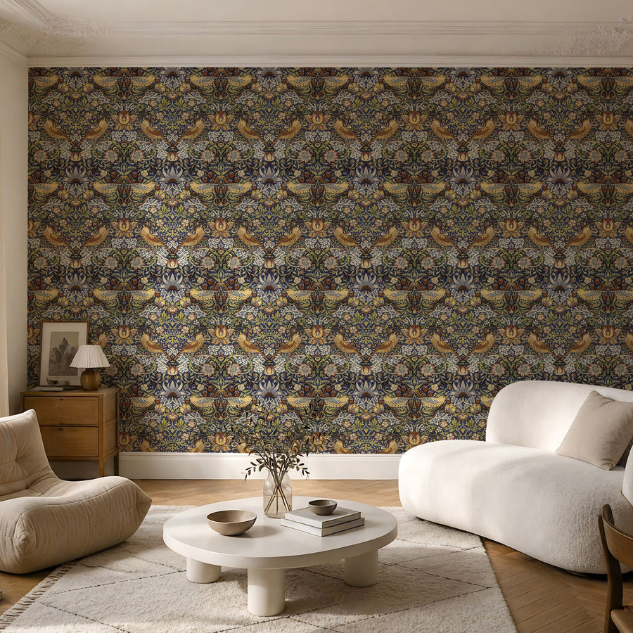 William Morris Strawberry Thief navy wallpaper in a sitting room with a cream sofa