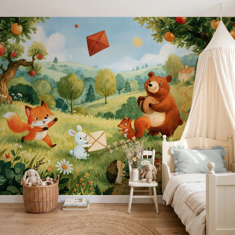 Woodland animals kite flying mural with apple trees behind a canopy bed in a child's bedroom